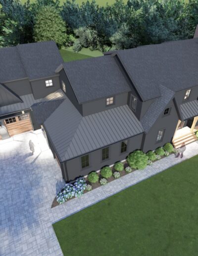 Aerial view of a large, grey house with multiple gables, surrounded by greenery. It has a stone driveway, a garage, and a lit entrance at the front.